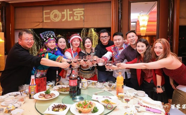 A group of 10 male and female entrepreneurs toast the new year.