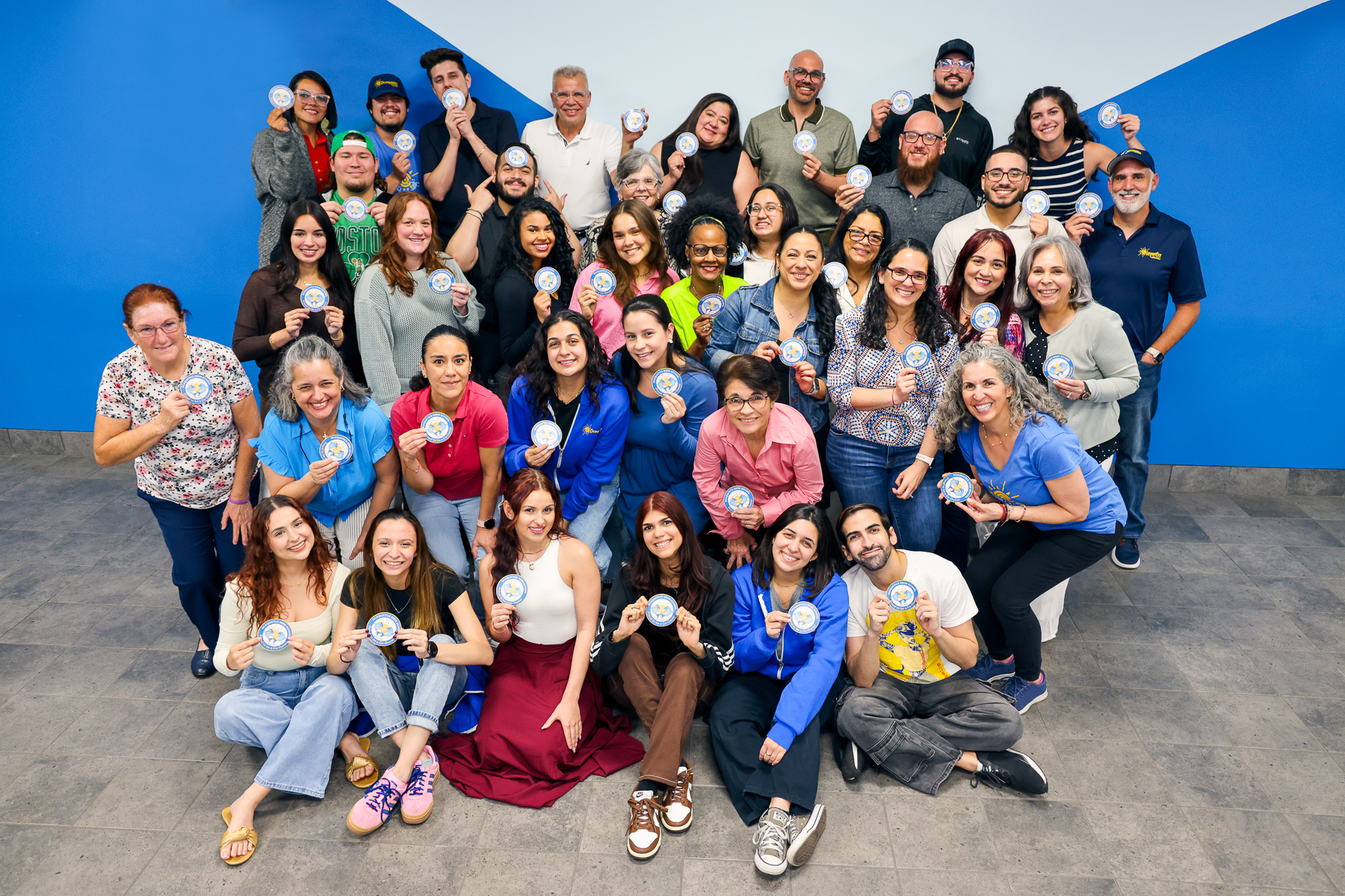 About 40 Ocaquatics employees pose in a casual group.