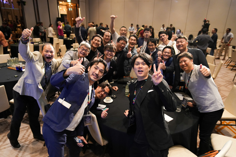 A group of enthusiastic entrepreneurs give the thumbs-up signal of happiness.