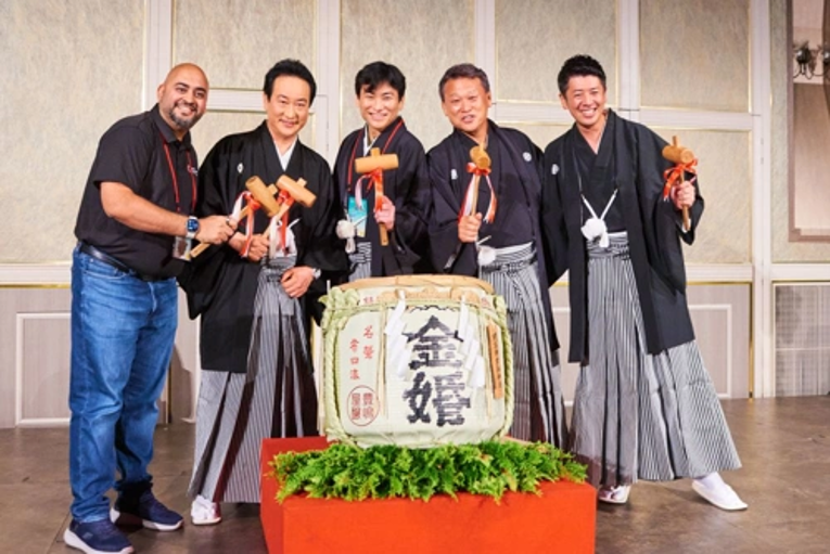 Five members of EO Japan pose with a ceremonial drum.