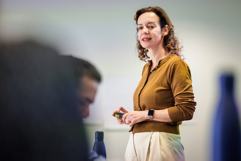A woman teaches an executive education class.